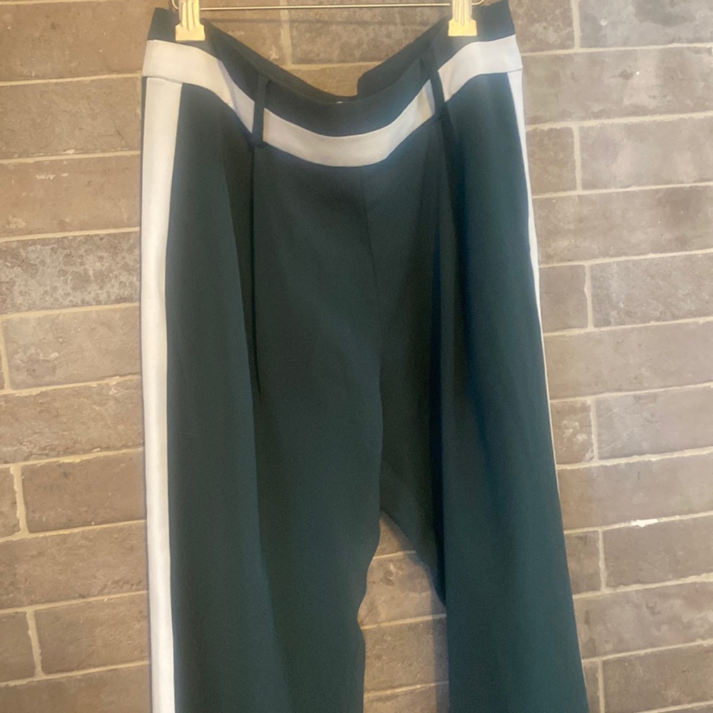 Parker pleated dress pants with a verticals white stripe down each pant leg